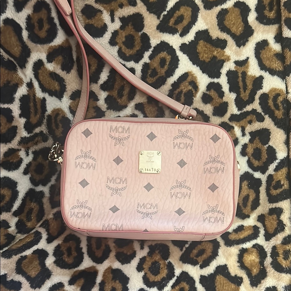 MCM Pink Crossbody Bag with Logo Pattern and Gold Emblem
